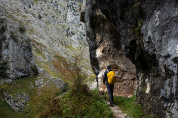 Man trekking on Ruta del Cares trail in Picos de Europa national park, Spain