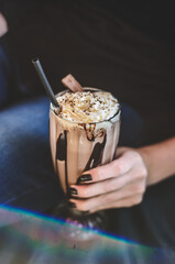 Holding a Chocolate Milkshake 