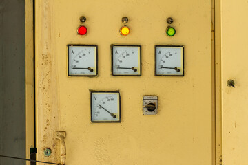 The fuse box in an office building, placed in the corner of an area that is not disturbed by traffic, control and safety devices