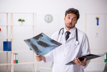 Young male doctor radiologist working in the clinic