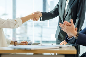 Business handshake for teamwork of business merger and acquisition,successful negotiate,hand shake,two businessman shake hand with partner to celebration partnership and business deal concept