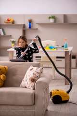 Young little girl doing housework at home