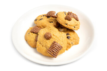 Fresh baked crispy cookies with choc chip, cashew nuts and chocolate textured cereal on white plate with white background. Clipping path.