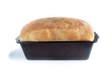 Homemade Fresh Bread in Black Vintage Bread Pan Isolated on White