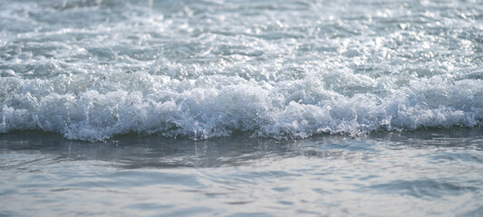 Close up to Little transparency wave on the Kata Beach in Phuket Thailand.