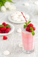Raspberry milkshake non alcoholic cocktail. Raspberry smoothie weight loss concept. Berry smoothie in a glass on the breakfast