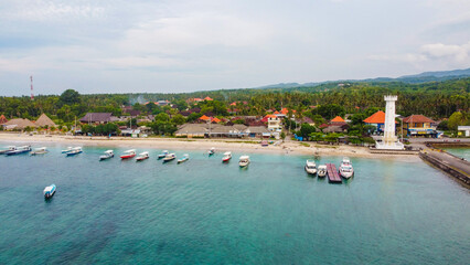 Obraz premium aerial view of ships inNusa Penida island pier, very beautiful clear blue water