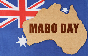 On the flag of Australia lies the contour of the map of the country with the inscription - Mabo Day