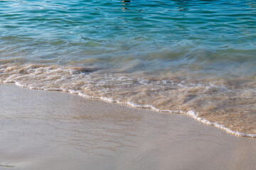 sandy seashore and big waves in summer