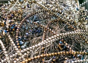 iron shavings, scrap metal, industrial waste, garbage, recyclable materials, recycling. blur, noise, artifacts. close-up