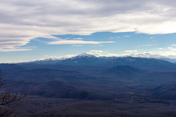 Winter mountain landscape on a sunny day, without snow cover, on observation decks.