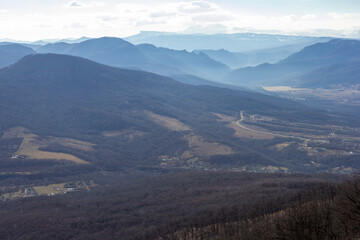 Fototapeta premium Winter mountain landscape on a sunny day, without snow cover, on observation decks.