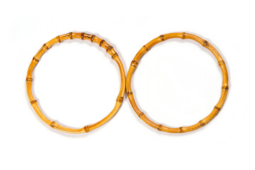 Two rings of bamboo on a white background.