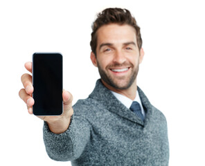 This is the latest must-have new app. Studio portrait of a handsome businessman showing a phone with a blank screen against a white background.