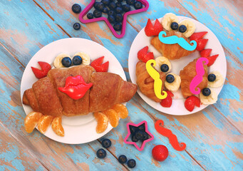 Fun idea for kids breakfast. Cute crab croissant with berries and fruits. Fun food for children.	