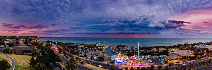 Stormy Arcus shelf cloud approaching the Frankston coastline in the afterglow of sunset with...
