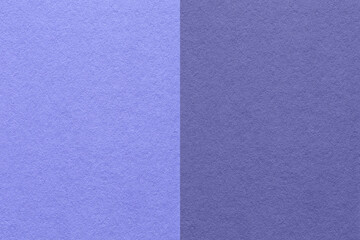 Fototapeta premium Texture of blue paper background, half two colors, macro. Very peri color of the year 2022.
