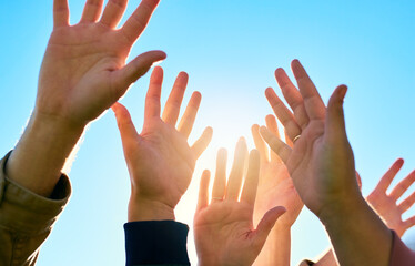 Put your hands in the air and celebrate life. Cropped shot of a group of unrecognizable peoples...