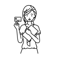 立って書類とカードを手に持つオフィスカジュアルの女性