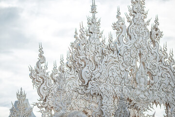 background Wat Rong Khun The White Temple and pond with fish, in Chiang Rai, Thailand