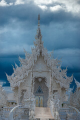 background Wat Rong Khun The White Temple and pond with fish, in Chiang Rai, Thailand