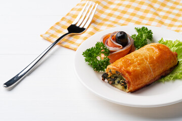 Traditional Russian pie or patty on white plate