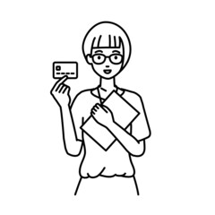 立って書類とカードを手に持つ教師の女性