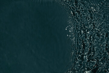 Black transparent clear calm water surface texture with ripples, splashes Abstract nature...