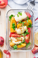 Fresh salad with mozzarella cheese and  peaches