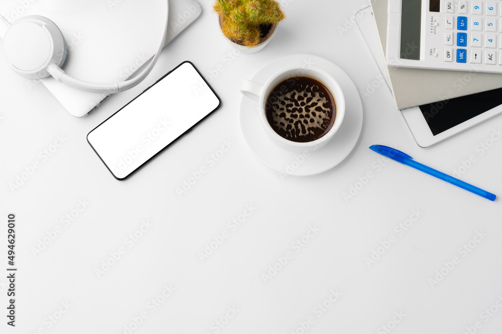 Poster Creative white table with blank cellphone and supplies