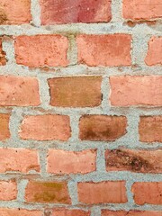 A wall made of red old bricks 