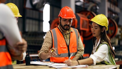 Professional male leader engineer assigning work to female engineer staff explaining, talking,...