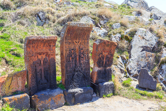 Armenian stone cross called khachkar on the territory of the ancient monastery of Sevanavark in Armenia 