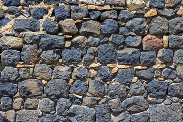 Texture of a stone wall in the ancient monastery of Sevanavank. Armenia