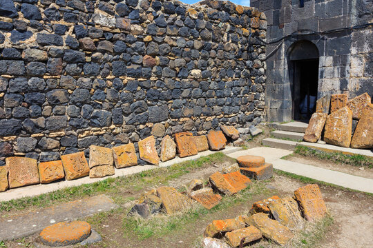 Armenian stone cross called khachkar on the territory of the ancient monastery of Sevanavark in Armenia 