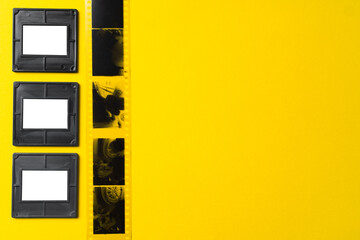 Photography empty slide frames on yellow background