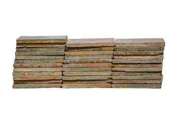 A pile of old concrete tiles in a stack isolated on white background.
