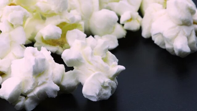 Rotating popcorn, close ip view in 4k. Macro shot of popcorn slowly spinning.