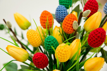 The breeze of spring. Easter composition with tulips and crocheted eggs. Featuring bouquets with handmade accents.