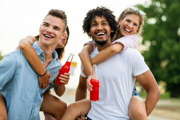 Obraz premium Portrait of friends having fun together on beach vacation. Student friend fun happiness concept.