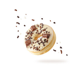 White chocolate glazed donut with dark crumbs and creme filled closeup flying. Sweet doughnut with...