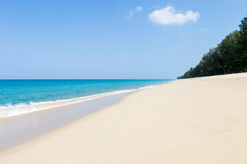Empty white fine sandy beach in south of Thailand, Khao Lak, Thailand, clean sand beach and clear blue sky, tropical island, summer holiday destination