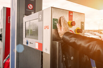 Filling car petrol. Pump gas fuel at gasoline oil station for nozzle tank. Black handle of the...