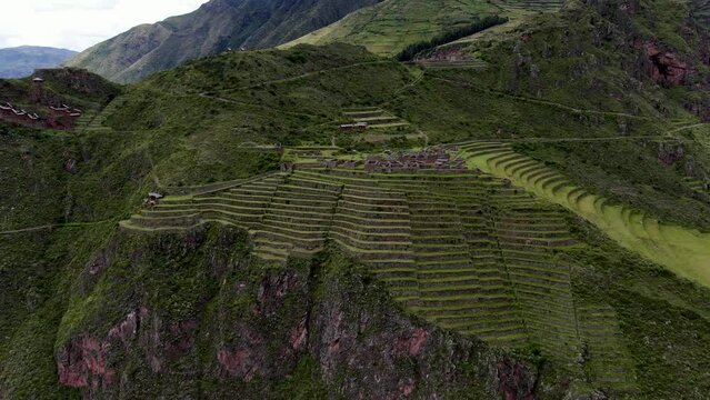 Towering Mountains With Farm Terraces In Pisac Ruins, Sacred Valley Of The Incas In Peru. Aerial Drone Shot
