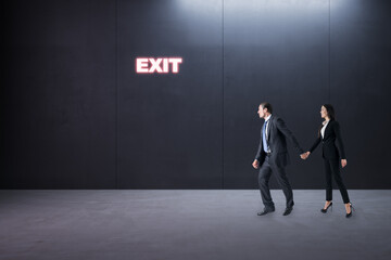 Obraz premium Thoughtful young businessman and woman standing in concrete interior with entrance to success. Way and opportunity concept.