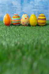 Easter eggs colored on grass  side view.