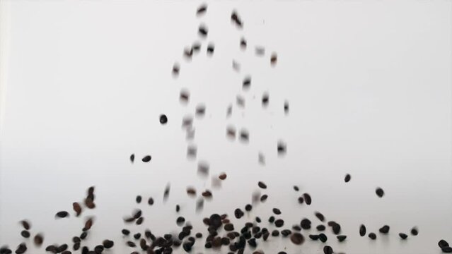 Coffee Beans Falling on White Floor Slow motion
