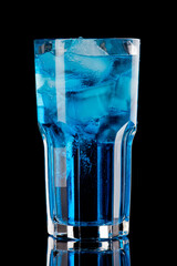 Blue lagoon alcoholic cocktail on black background