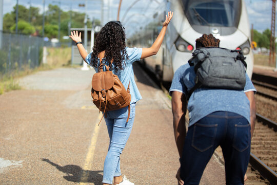 couple lost the train arrived late to the station platform