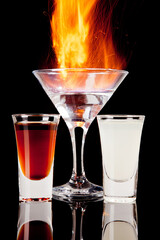 fired alcoholic cocktail isolated on black